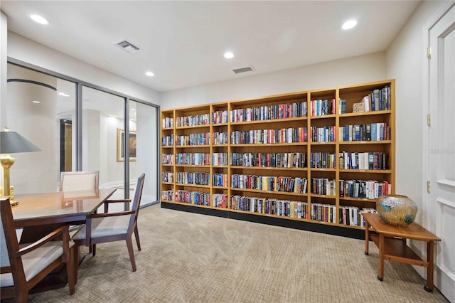 office space featuring carpet floors, visible vents, and recessed lighting