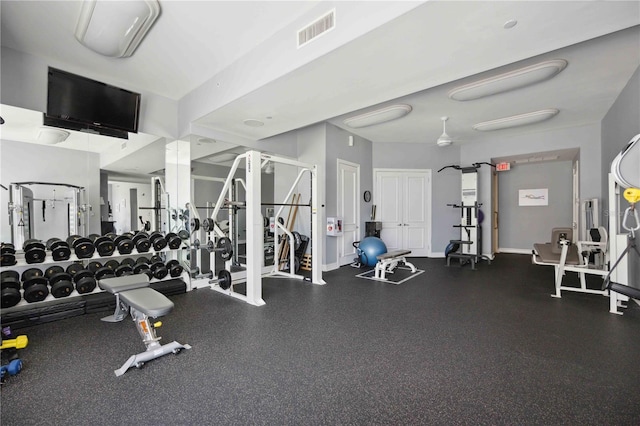 workout area featuring baseboards and visible vents