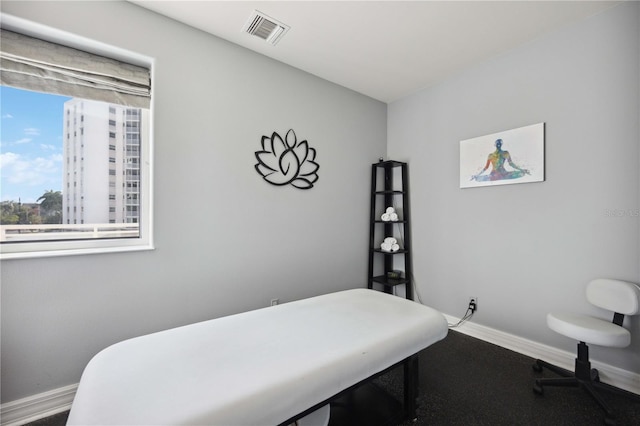 bedroom with visible vents and baseboards