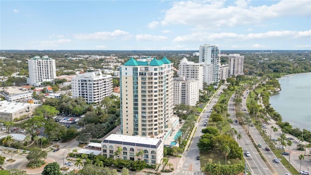 drone / aerial view with a view of city and a water view