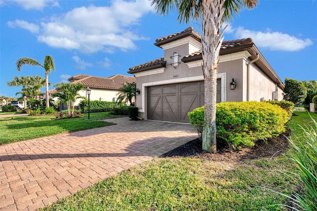 mediterranean / spanish house featuring a front lawn