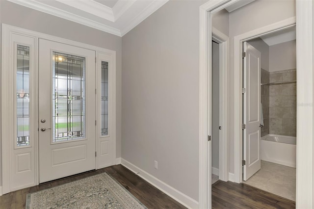 foyer featuring dark hardwood / wood-style flooring and ornamental molding