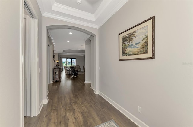 corridor with dark hardwood / wood-style flooring and crown molding