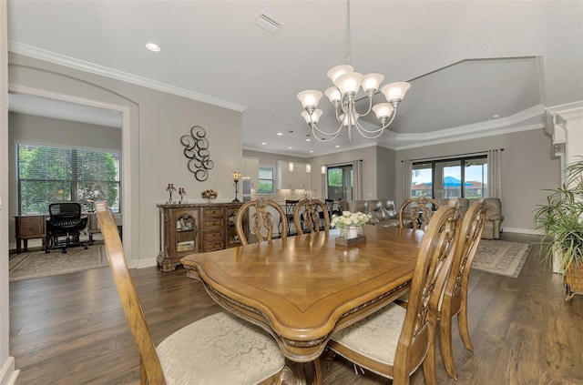 dining room with a chandelier, dark hardwood / wood-style flooring, and crown molding