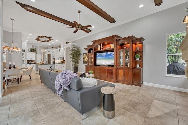 living room featuring ceiling fan, beamed ceiling, and ornamental molding