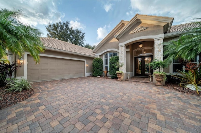 view of front of home featuring french doors and a garage