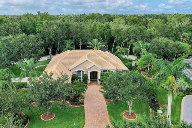 drone / aerial view featuring a view of trees