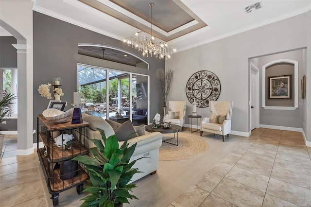 interior space featuring arched walkways, visible vents, plenty of natural light, and a tray ceiling