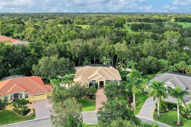 birds eye view of property with a wooded view