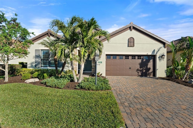 view of front facade with a garage and a front yard