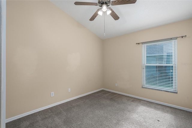 carpeted spare room with ceiling fan and lofted ceiling