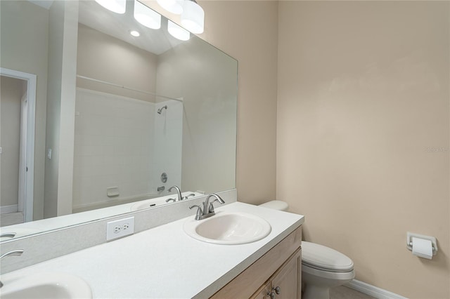 full bathroom with vanity, shower / bath combination, and toilet