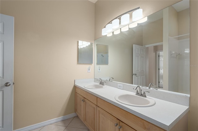 bathroom with tile patterned flooring and vanity