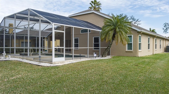 back of property featuring cooling unit, a lanai, and a lawn