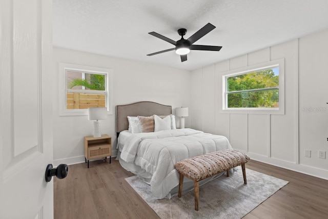 bedroom featuring hardwood / wood-style flooring and ceiling fan