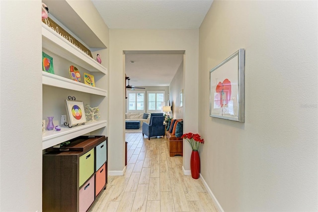 corridor featuring light hardwood / wood-style floors