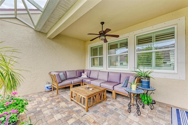 view of patio / terrace with ceiling fan and outdoor lounge area