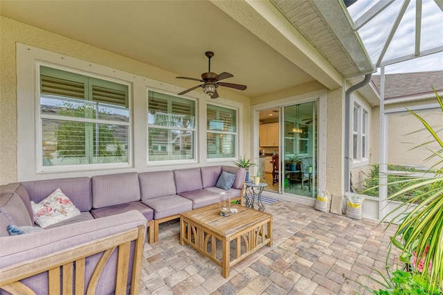 sunroom featuring ceiling fan