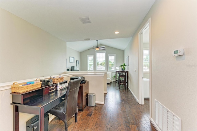 dining room featuring ceiling fan, dark hardwood / wood-style floors, and vaulted ceiling