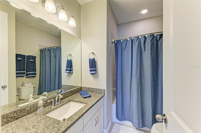 full bathroom with vanity, toilet, and shower / bath combo with shower curtain