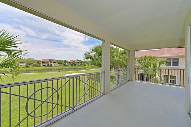 balcony featuring a water view