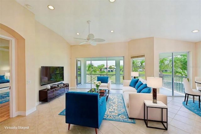 tiled living room featuring vaulted ceiling and ceiling fan