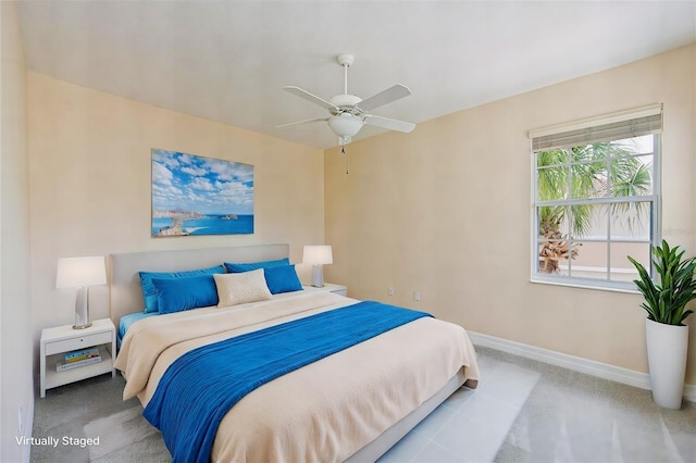 bedroom featuring ceiling fan and light carpet