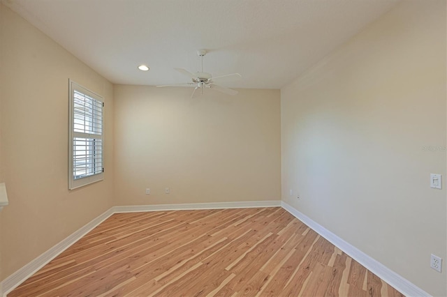 spare room featuring ceiling fan and light hardwood / wood-style flooring