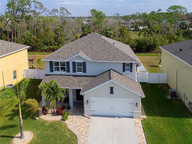 view of front of property featuring central AC unit and a front lawn