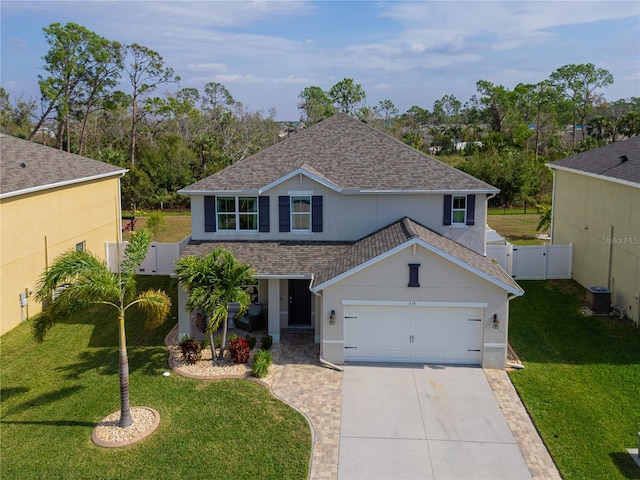 view of front of home with central AC unit and a front yard