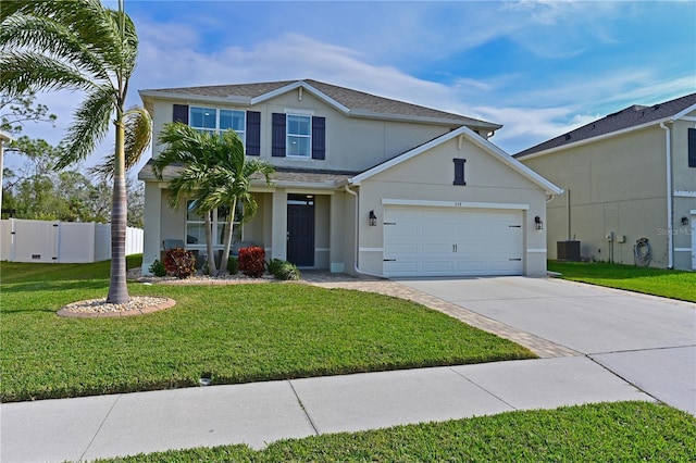 front of property with cooling unit, a front yard, and a garage