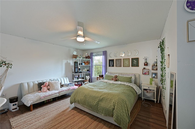 bedroom featuring ceiling fan and wood-type flooring