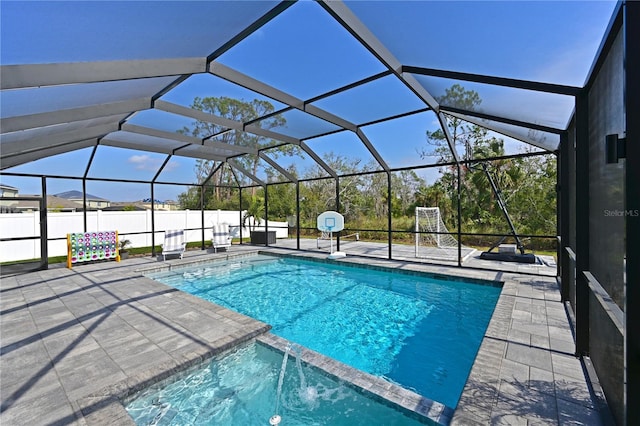 view of pool with a lanai and a patio