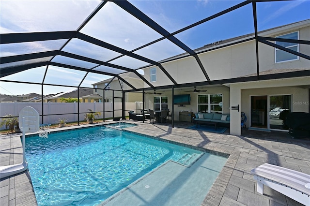 view of swimming pool featuring glass enclosure, an outdoor living space, ceiling fan, and a patio