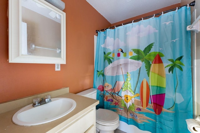 bathroom with walk in shower, vanity, a textured ceiling, and toilet