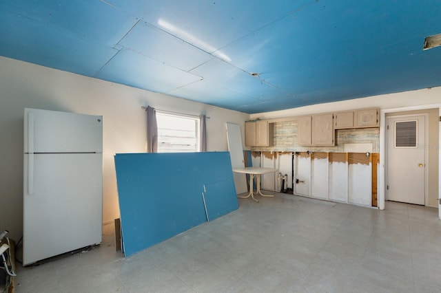 garage with white fridge