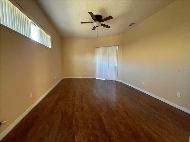 unfurnished room featuring ceiling fan and dark hardwood / wood-style floors