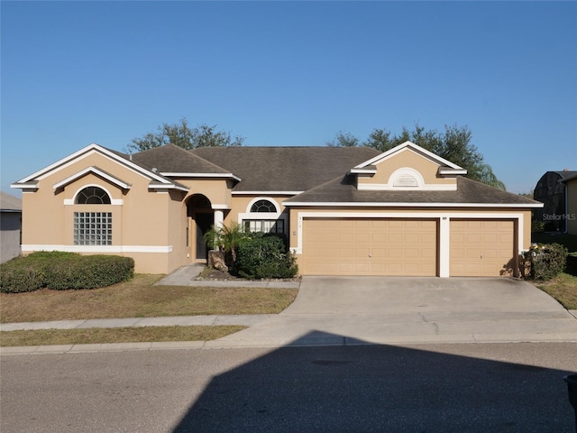 ranch-style home featuring a garage