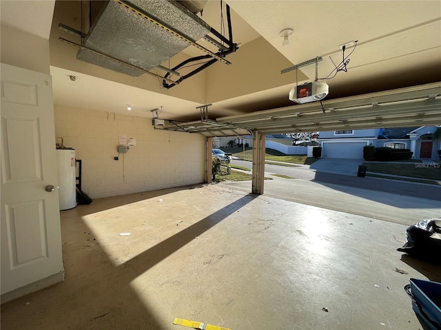 garage featuring gas water heater and a garage door opener