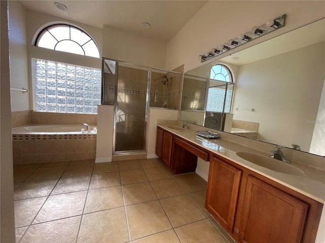 bathroom with vanity, tile patterned floors, a wealth of natural light, and independent shower and bath