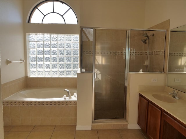 bathroom featuring vanity, tile patterned floors, and separate shower and tub