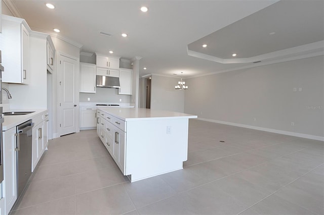 kitchen featuring a center island, an inviting chandelier, stainless steel dishwasher, light tile patterned floors, and white cabinetry