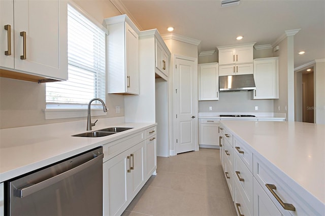 kitchen featuring dishwasher, white cabinets, ornamental molding, and sink