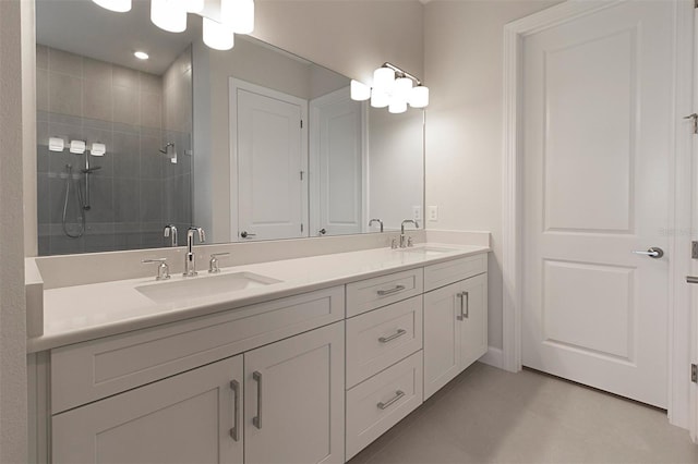 bathroom with vanity and a shower