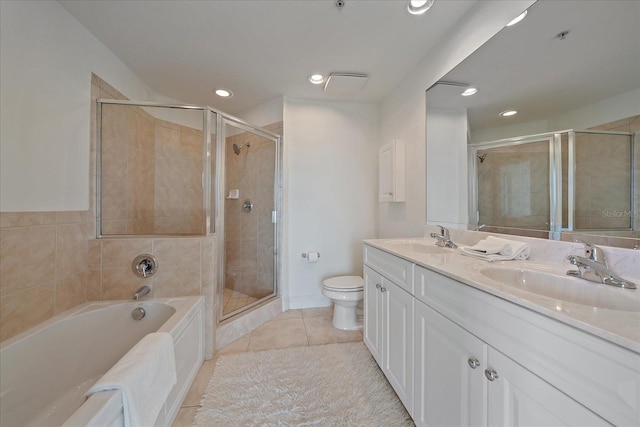 full bathroom featuring shower with separate bathtub, vanity, tile patterned floors, and toilet