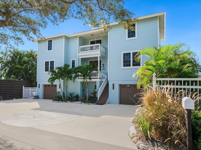 view of front of house with a balcony and a garage