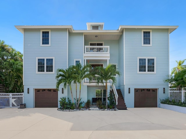 view of front of house with a balcony and a garage