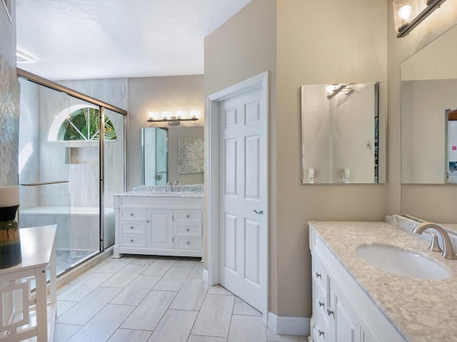 bathroom featuring vanity, tile patterned floors, and a shower with door