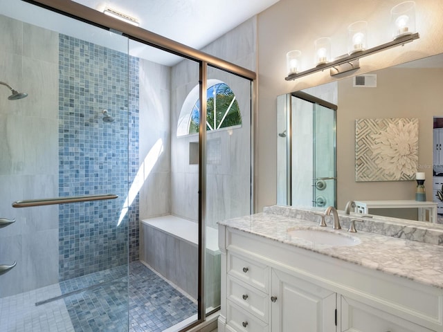 bathroom featuring vanity and walk in shower