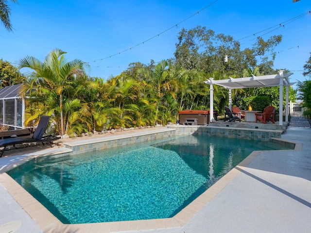 view of swimming pool with a pergola, a patio area, and a hot tub